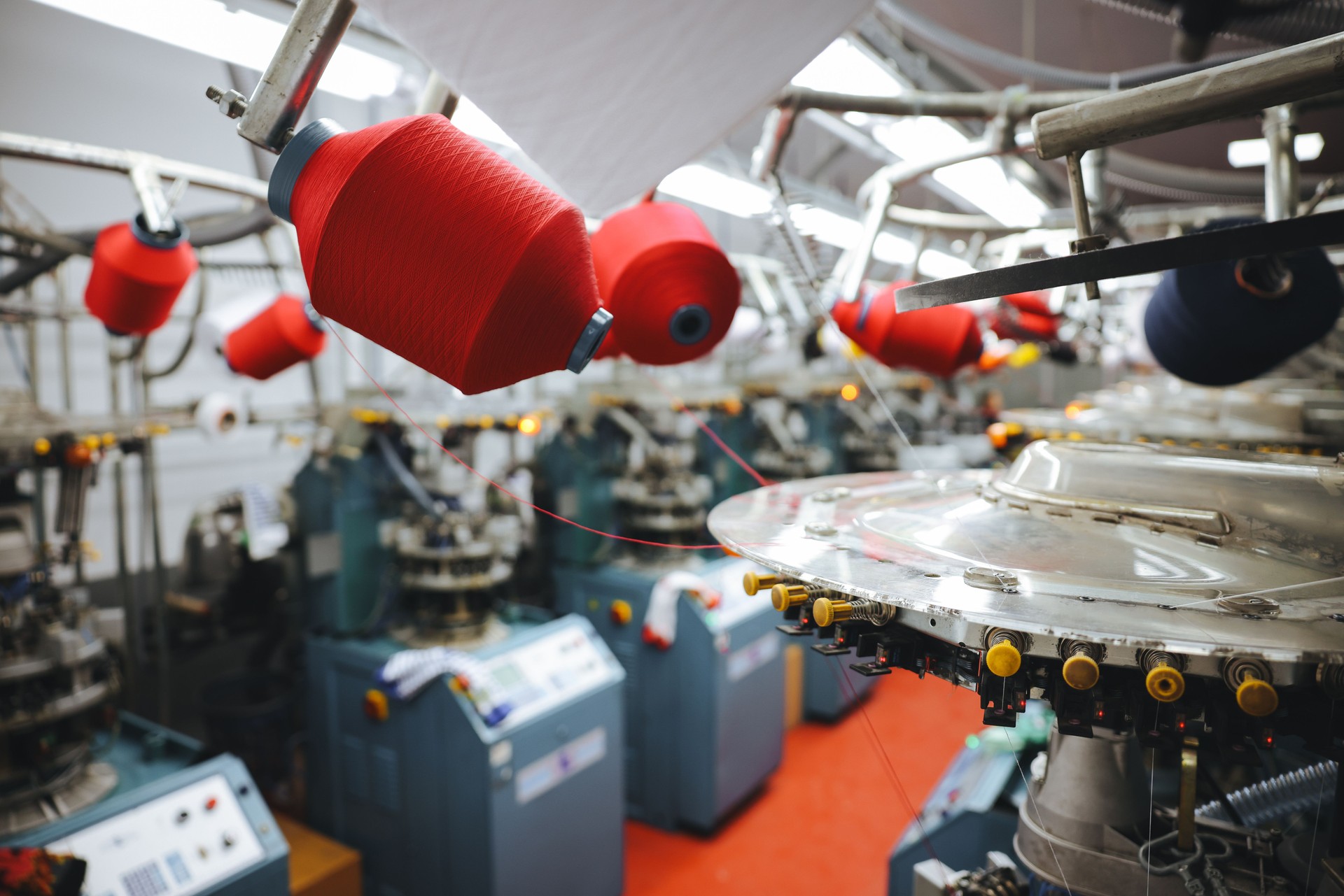 Colorful Threads on a loom in weaving loom machine in textile factory