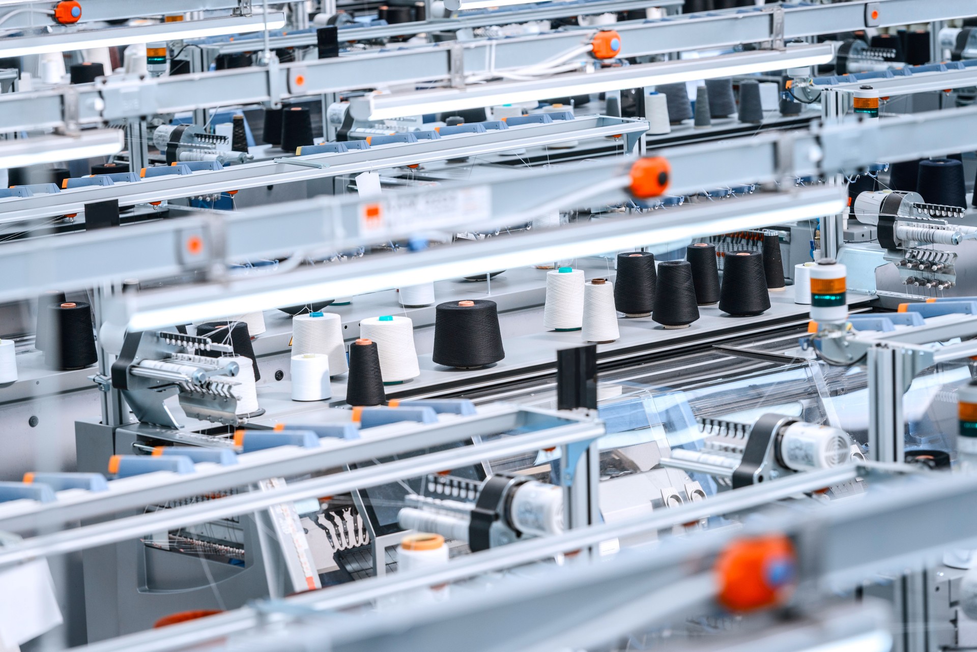 Industrial knitting machines operating in textile factory